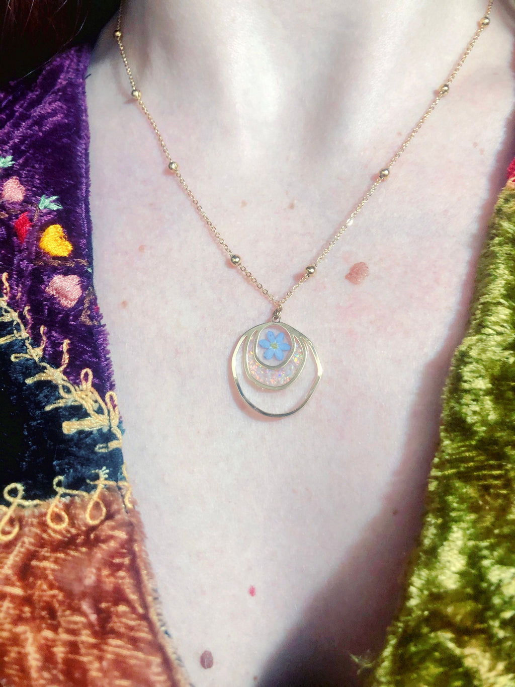 Forget me not real flower necklace and UV resin opal flakes. 18k gold plated Circles pendant.Resin jewelry.Forget-me-not pressed flowers