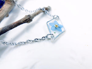 Bracciale donna terrarium fiore vero forget me not azzurro nontiscordardimé Ciondolo resina catena acciaio taglia unica.Gioielli resina