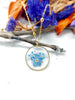 Collana fiori veri nontiscordardimé Forget me not in resina uv. Ciondolo cerchio oro catena acciaio.Gioielli resina.Fiori pressati essiccati