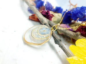 Forget me not real flower necklace and UV resin opal flakes. 18k gold plated Circles pendant.Resin jewelry.Forget-me-not pressed flowers