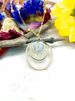 Forget me not real flower necklace and UV resin opal flakes. 18k gold plated Circles pendant.Resin jewelry.Forget-me-not pressed flowers