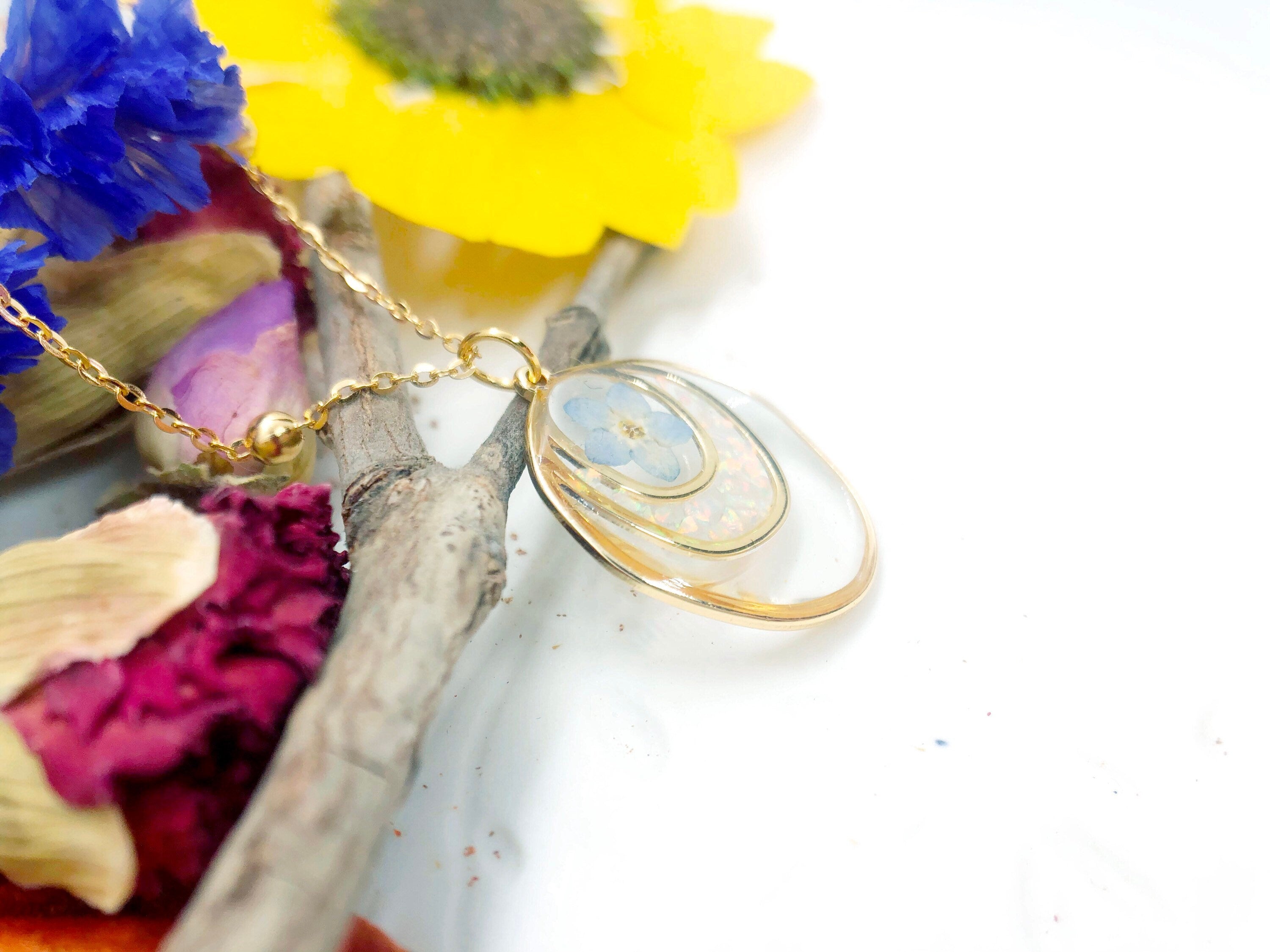 Forget me not real flower necklace and UV resin opal flakes. 18k gold plated Circles pendant.Resin jewelry.Forget-me-not pressed flowers