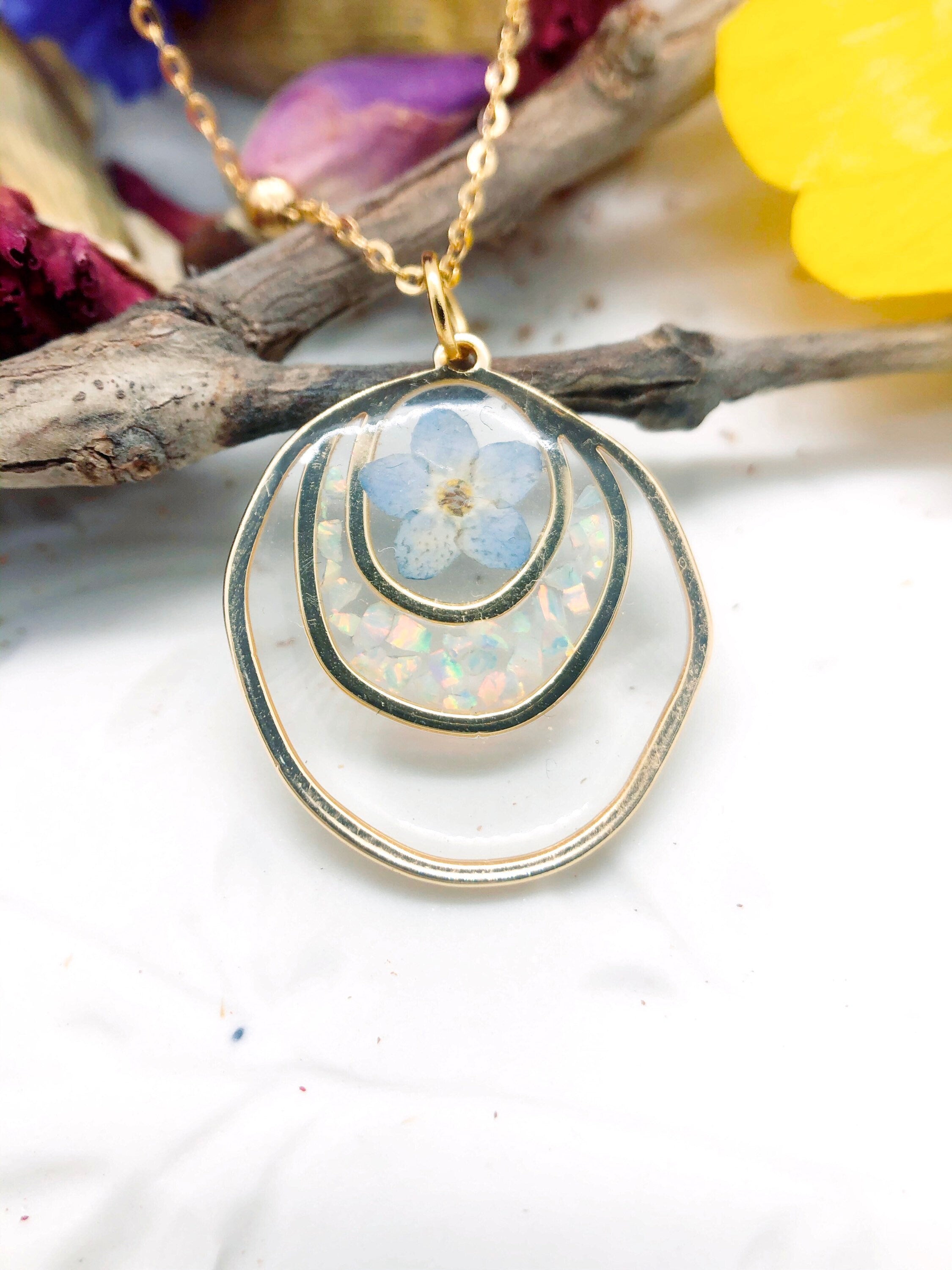 Forget me not real flower necklace and UV resin opal flakes. 18k gold plated Circles pendant.Resin jewelry.Forget-me-not pressed flowers