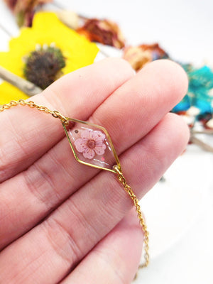 Bracciale donna terrarium fiore vero selvatico rosa. Ciondolo resina catenella acciaio regolabile taglia unica.Gioielli resina fiori.