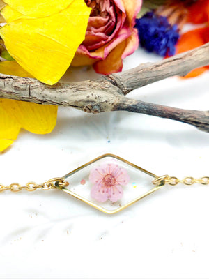 Bracciale donna terrarium fiore vero selvatico rosa. Ciondolo resina catenella acciaio regolabile taglia unica.Gioielli resina fiori.