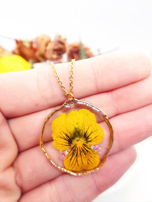 Woman yellow pansy tiger eye real flower necklace.Real flower jewelry in resin.gold circle pendant charm. Unique gift